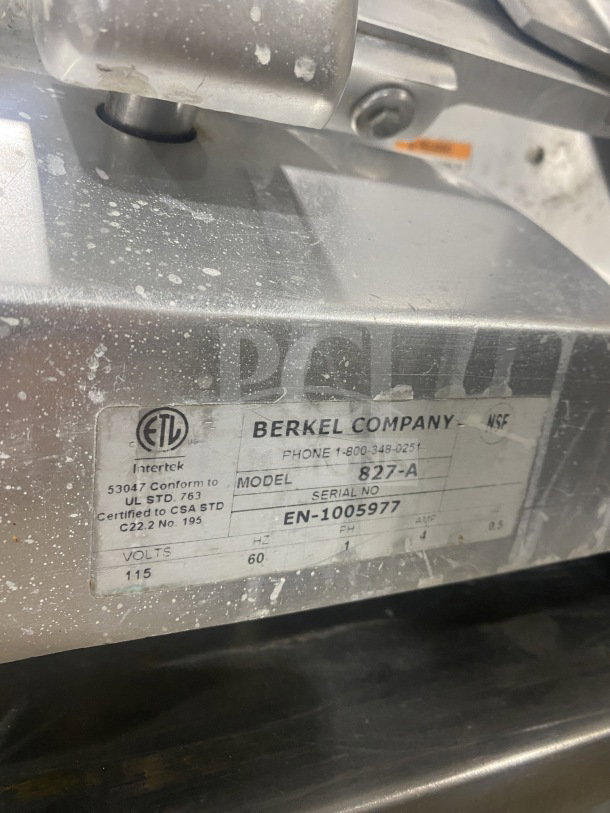 Berkel Model 827-A commercial deli meat slicer, stainless steel, electric, serial EN-1005977, 115V, 1 phase. Marked ETL.
