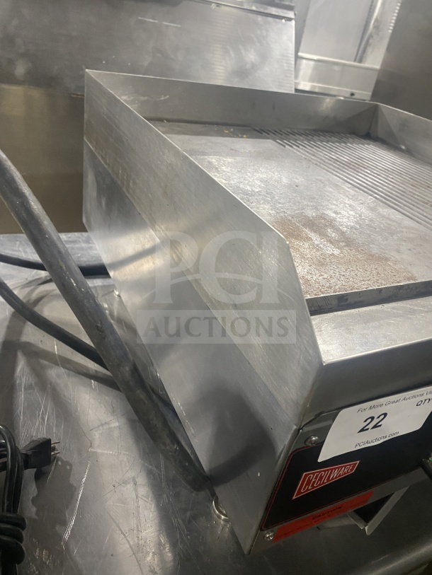 Cecilware commercial countertop stainless steel electric charbroiler in used condition, featuring ribbed grilling surface and power cable.