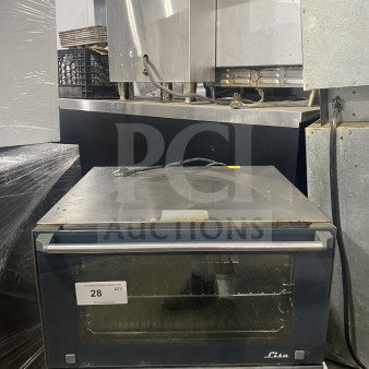 Unox Cadco Lisa Series countertop convection oven, model XAF013, with metal racks, 120V. Visible wear on exterior.