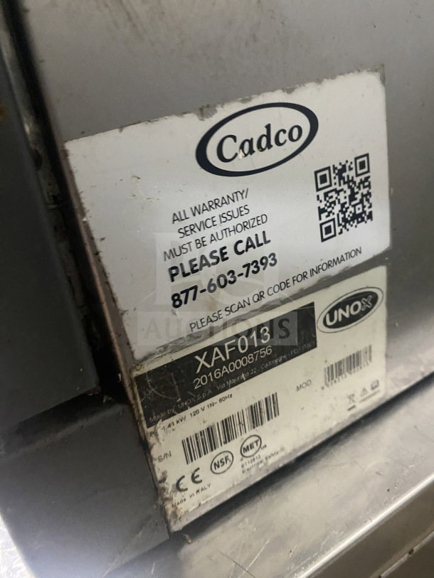 Unox Cadco Lisa Series convection oven model XAF013 with metal racks, 120V, serial number 20160008756, warranty info.