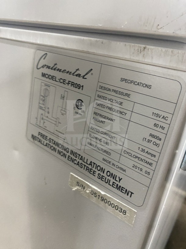 2019 Continental CEFR091 chest freezer, white, solid lid, electric, 115V. Serial: 0519000038. Good condition, model label visible.