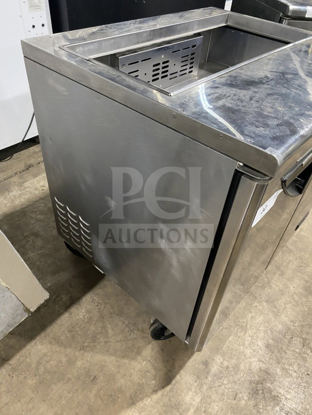 Turbo Air TST-36SD stainless steel refrigerated prep table with cutting board, 2-door storage, on casters, 115V.