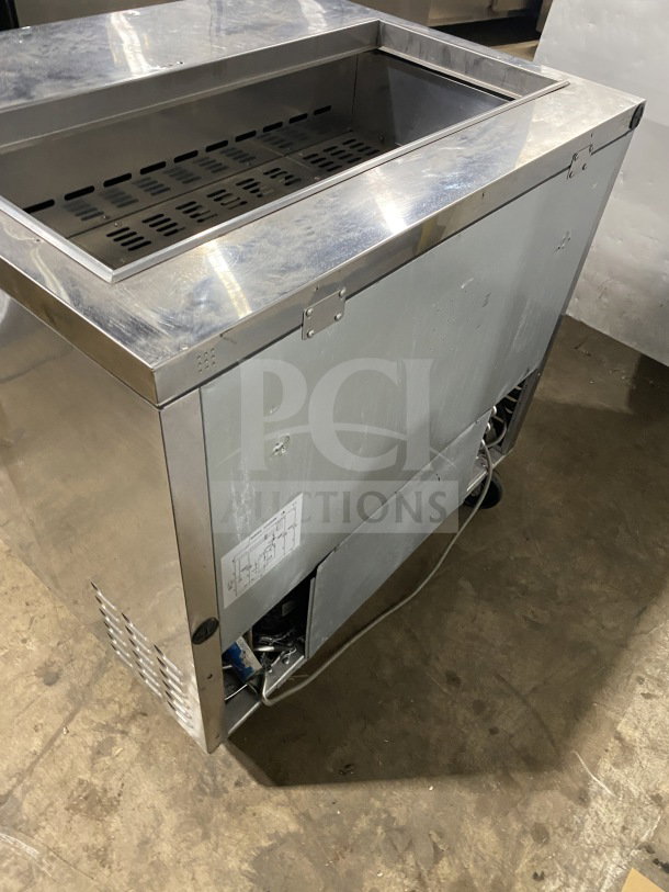 Turbo Air TST-36SD commercial stainless steel sandwich prep table with cutting board, two-door storage, on casters, 115V.