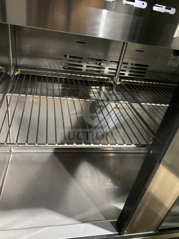 Turbo Air TST-36SD stainless steel refrigerated sandwich prep table, 2-door storage, commercial cutting board, on casters.