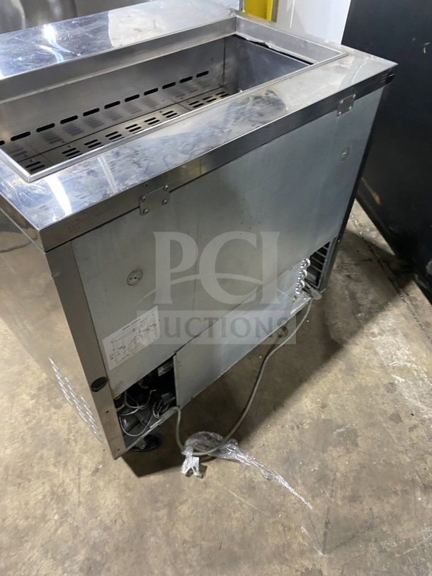 Turbo Air TST-36SD stainless steel refrigerated sandwich prep table with cutting board, 2-door storage, on casters. 115V.