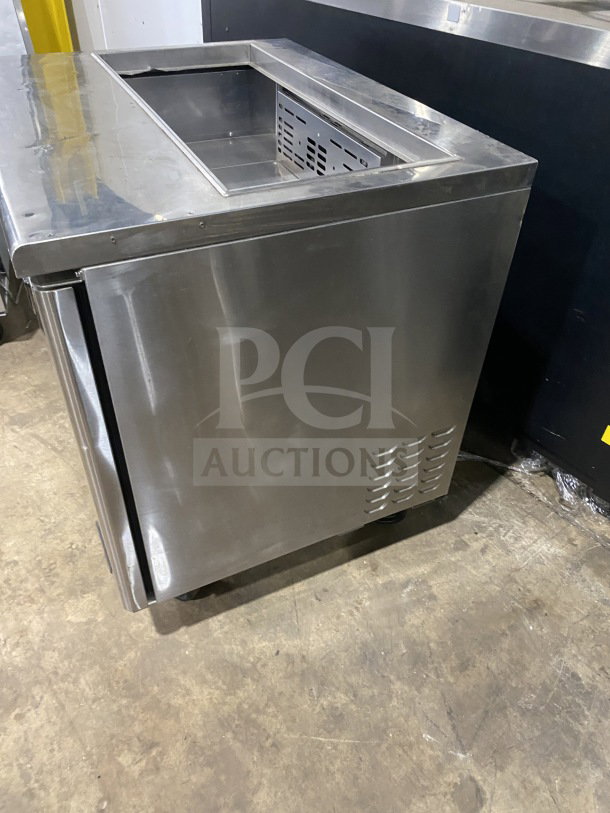 Turbo Air TST-36SD stainless steel refrigerated prep table with 2-door storage and cutting board on casters, 115V.
