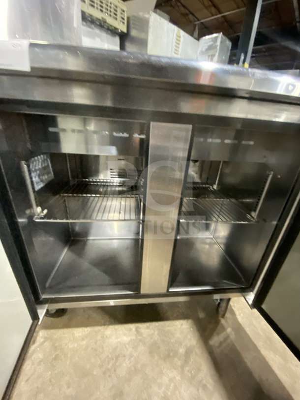 Turbo Air TST-36SD refrigerated sandwich prep table with cutting board, two-door storage, on casters, 115V, stainless steel.