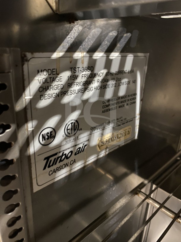 Turbo Air TST-36SD refrigerated sandwich prep table with cutting board, 2-door storage, and casters. Model: TST-36SD SN: S310312016.