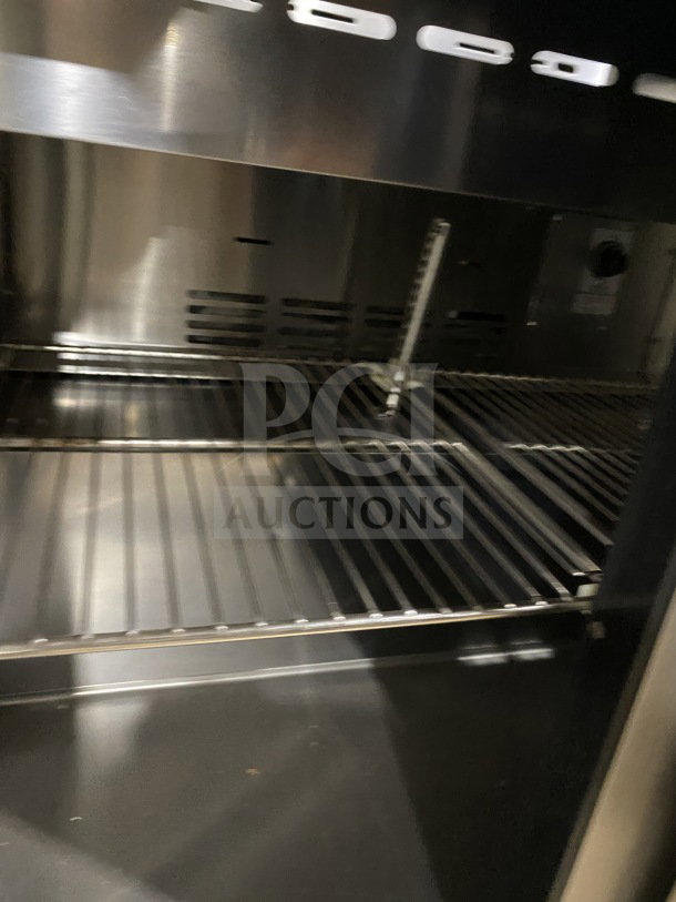 Turbo Air TST-36SD stainless steel refrigerated sandwich prep table with 2-door storage, cutting board, on casters.