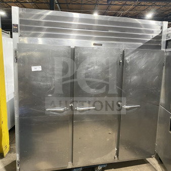 Traulsen G31010 Commercial Stainless Steel Triple Door Reach-In Freezer, Energy Star, with casters and poly-coated racks.