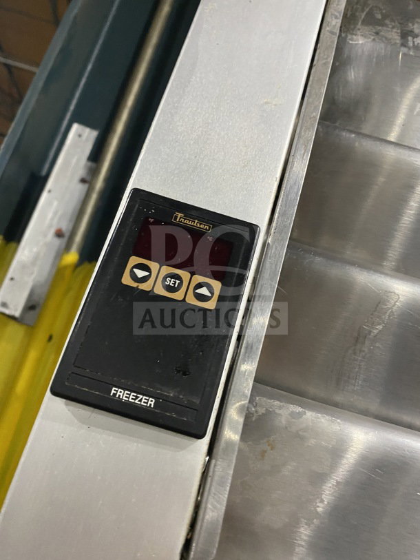 Traulsen Commercial Triple Door Freezer, model G31010, stainless steel, digital controls, Energy Star certified, on casters.