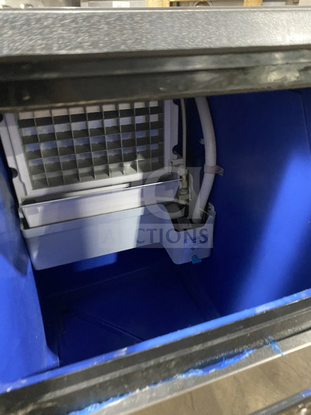 Vevor BY-90PF ice maker interior, showing ice cube grid. Stainless steel, digital controls. Model: BY-90PF, 110V.