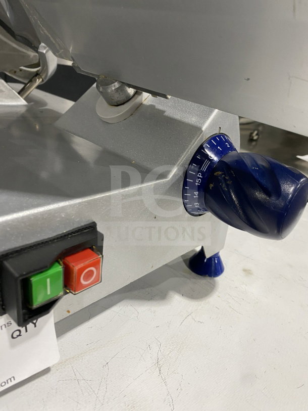 Commercial stainless-steel electric countertop meat slicer with adjustable thickness dial, power buttons, and sturdy legs.