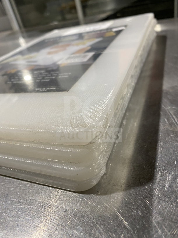 Brand new Thunder Group PLCB002 white non-skid plastic cutting board with handle hole. Still in packaging.