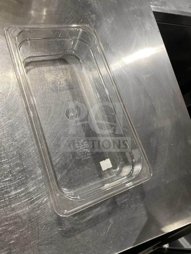 Cambro translucent polypropylene full-size food pan, model 631-1, in excellent condition on metal surface.