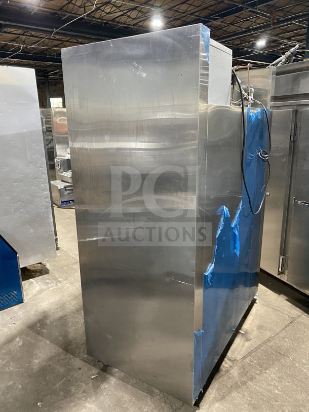 Traulsen Spec-Line Series stainless steel 2-door reach-in freezer, model RLT232WUTFHS, on casters, with chrome wire rack.