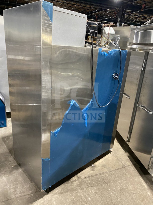 Traulsen Spec-Line 2-Door Stainless Steel Freezer, Model RLT232WUTFHS, with chrome rack, on casters, visible wiring.