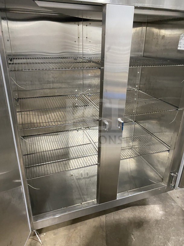 Traulsen Spec-Line stainless steel 2-door reach-in freezer, Model RLT232WUTFHS, chrome wire racks, on casters.