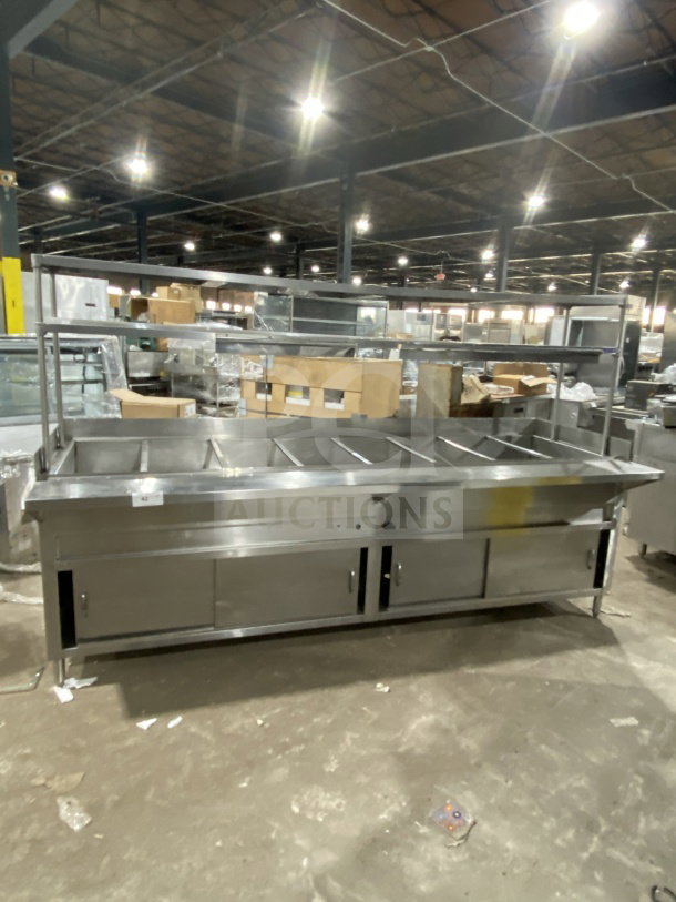 L&J commercial stainless steel 5-well steam table with double overshelf, sliding 2-door base, on legs; used condition.