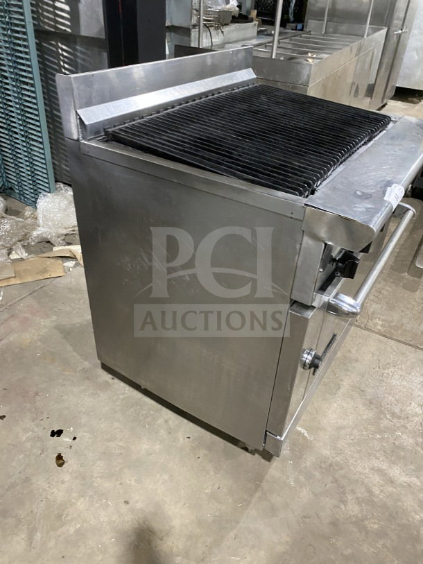 American Range commercial stainless steel gas-powered range with full charbroiler, standard oven base, wired rack, on casters.