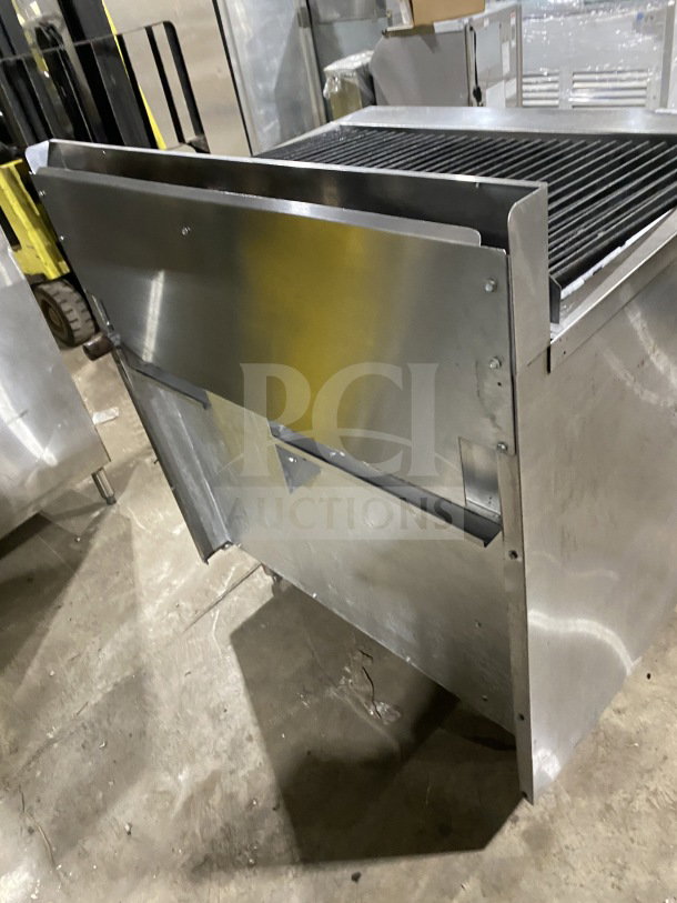 American Range commercial stainless steel gas-powered range with full charbroiler, standard oven base, wired rack, on casters.