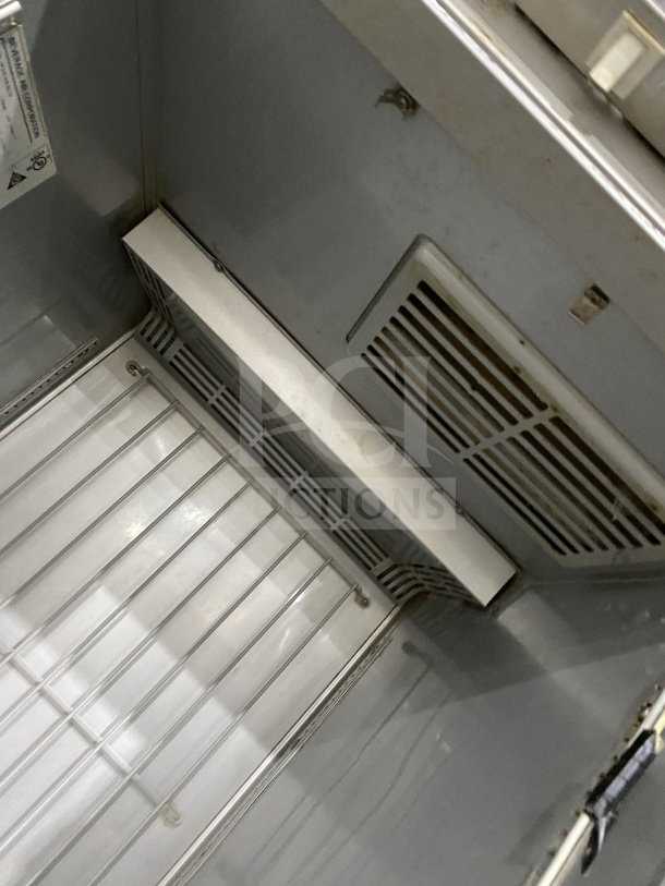 Beverage Air Horizon Series stainless steel half-door refrigerator/freezer interior with poly coated wired rack, model HF1HC-1HS-RC-18.