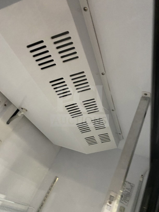 Dukers Pantin Series GDM40BS commercial refrigerator interior, showcasing vents and poly coated rack, in excellent condition.