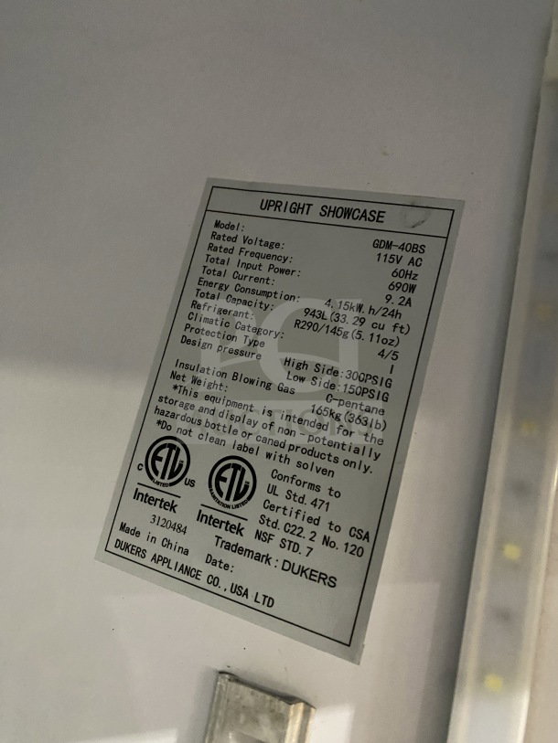 Dukers GDM40BS refrigerator label showing model, voltage, energy use, capacity, and certifications.