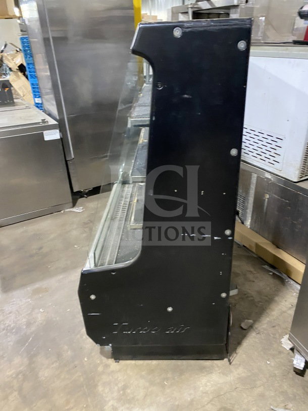 Turbo Air TOM-40M(B) black refrigerated display case, stainless steel interior, multi-tier, used condition, 120V 1 Phase.