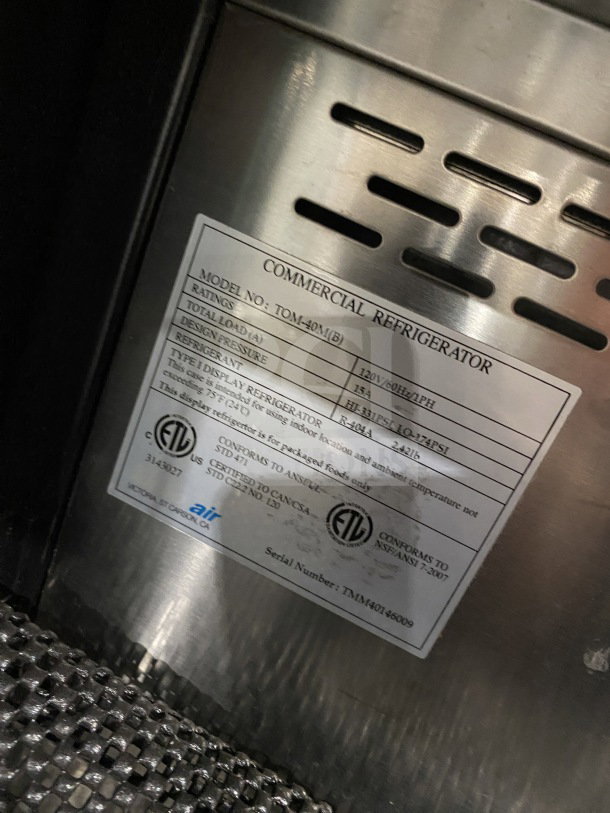 Turbo Air TOM-40M(B) refrigerated merchandiser label, 120V, stainless steel interior, serial TMM40146009, ETL certified.