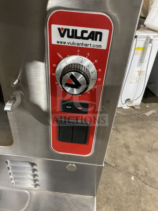 Vulcan V3X246 commercial food steamer control panel with logo, timer dial, and ready/cook buttons. Stainless steel finish.
