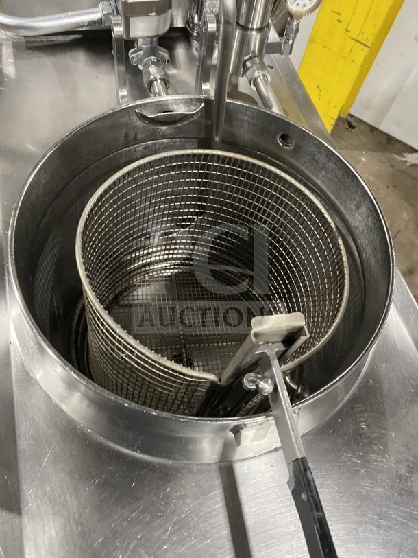 BKI LPF F48 commercial electric pressure fryer with oil filter, viewed from above showing interior basket. Mounted on casters.