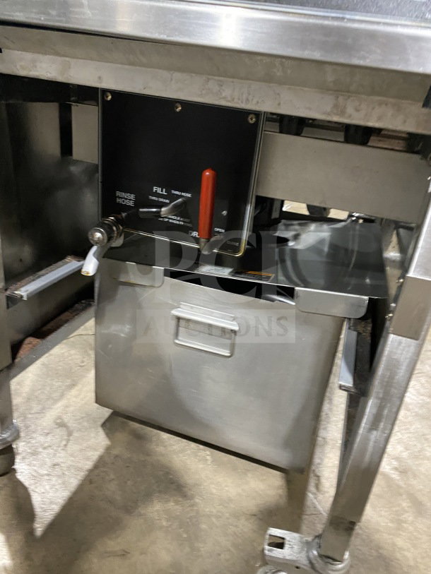 BKI LPF F48 electric pressure fryer with oil filter, on casters. Control panel features fill and drain options. Model: LPF-F48.