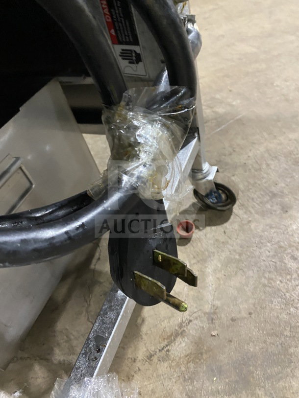 BKI LPF-F48 commercial pressure fryer, electric, with oil filter, 208V, on casters. Power cord and plug visible.