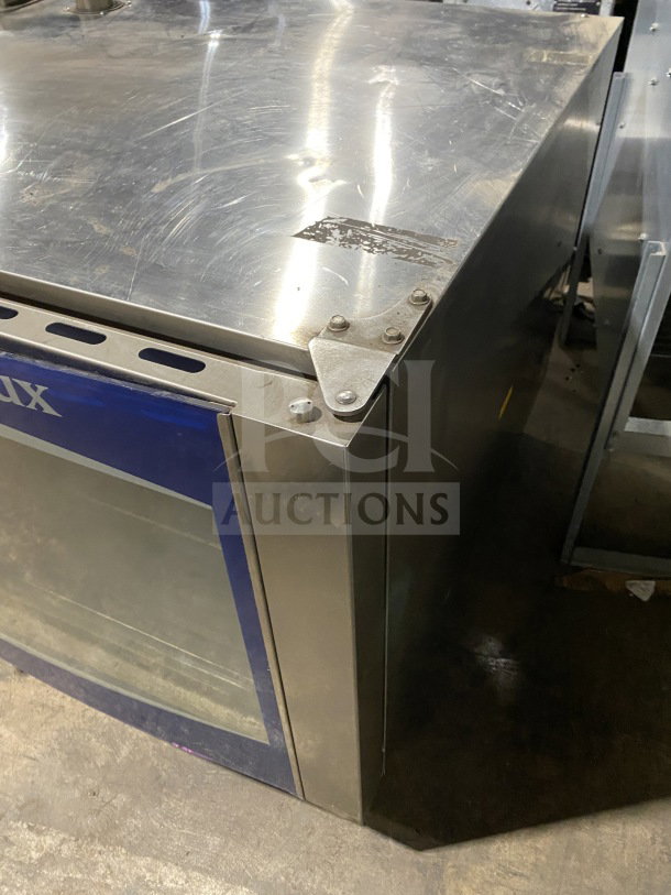 Electrolux Air-O-Convect commercial combi oven, model AOS062GKP1, in stainless steel. Features touch controls, wired rack.
