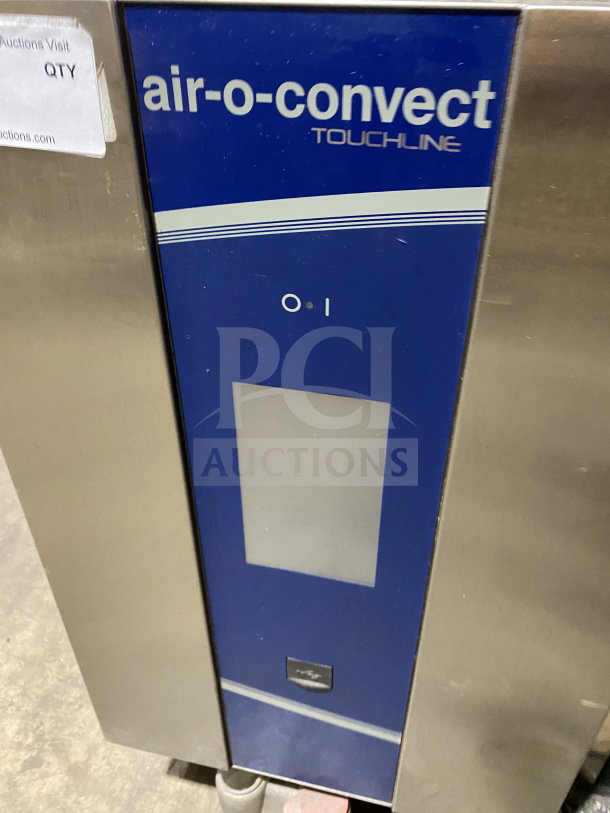 Electrolux Air-O-Convect AOS062GKP1 stainless steel combi oven with touch controls and wired rack, 120V, on legs.