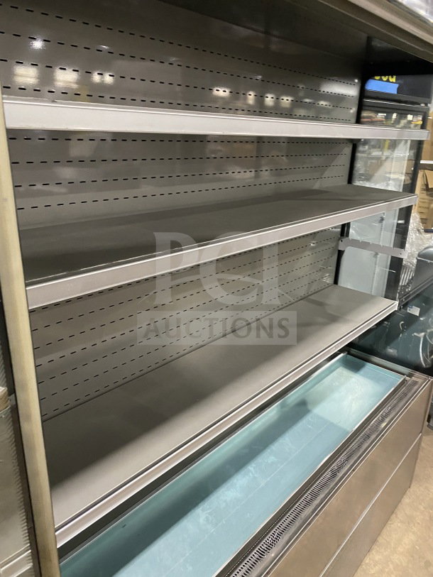 Commercial stainless-steel open-air merchandiser, electric powered, with multiple shelves, good condition.