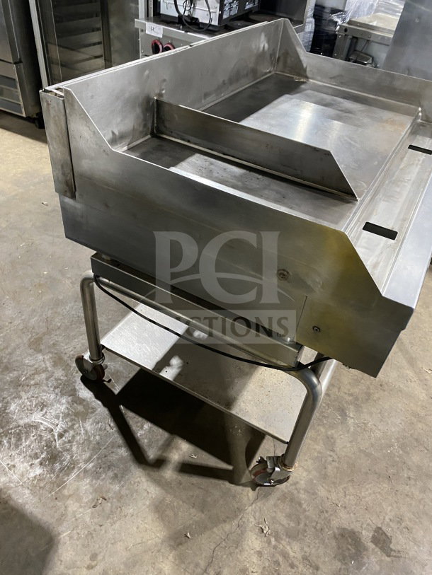 AccuTemp Accu-Steam stainless-steel griddle on rolling stand; gas-powered, flat-top, commercial grade, excellent condition.