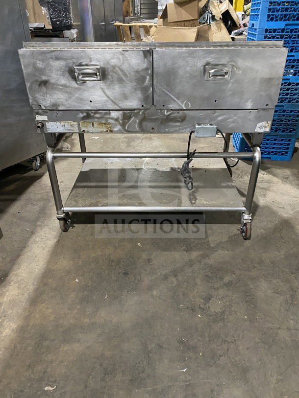 AccuTemp Accu-Steam stainless-steel flat-top griddle on rolling stand, gas powered, commercial use, good condition.