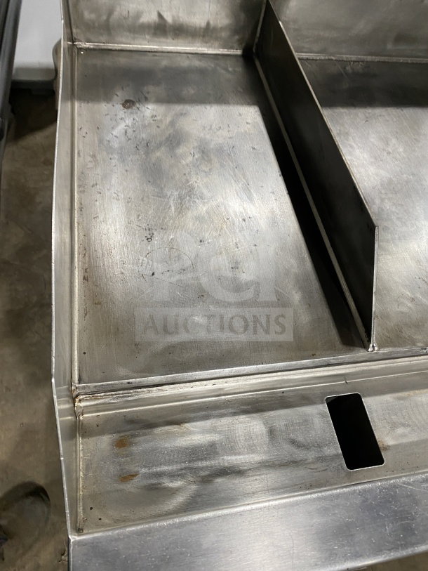 AccuTemp Accu-Steam commercial stainless-steel flat-top griddle, gas-powered, mounted on rolling stand, clean condition.