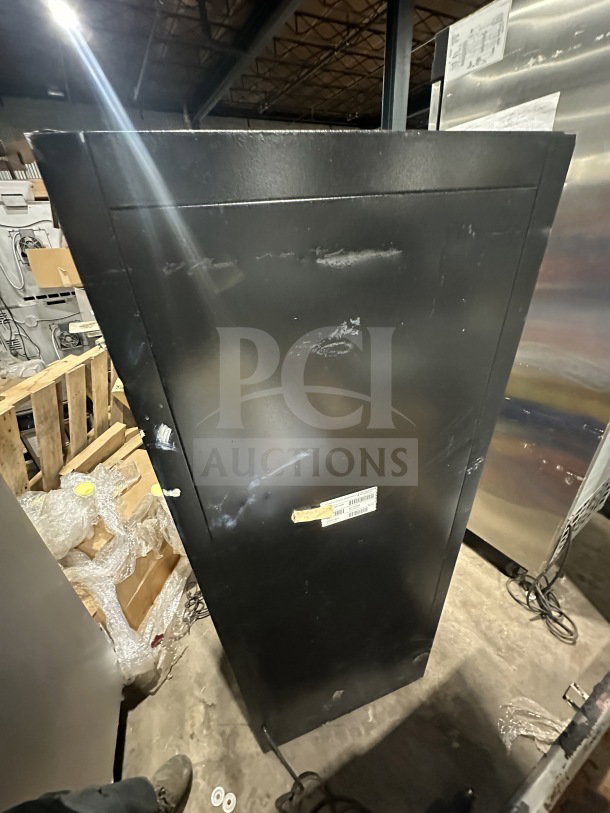 Habco Snapple Style commercial refrigerator, Model ESM12. Black exterior, single glass swing door, poly coated wire rack. Energy Star certified. Serial number 220514 visible. 115V, 1 phase.