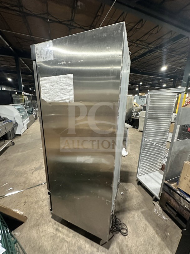 Everest EBF1 commercial stainless steel single door reach-in freezer, poly coated wire rack, SN: 11500004, on casters.