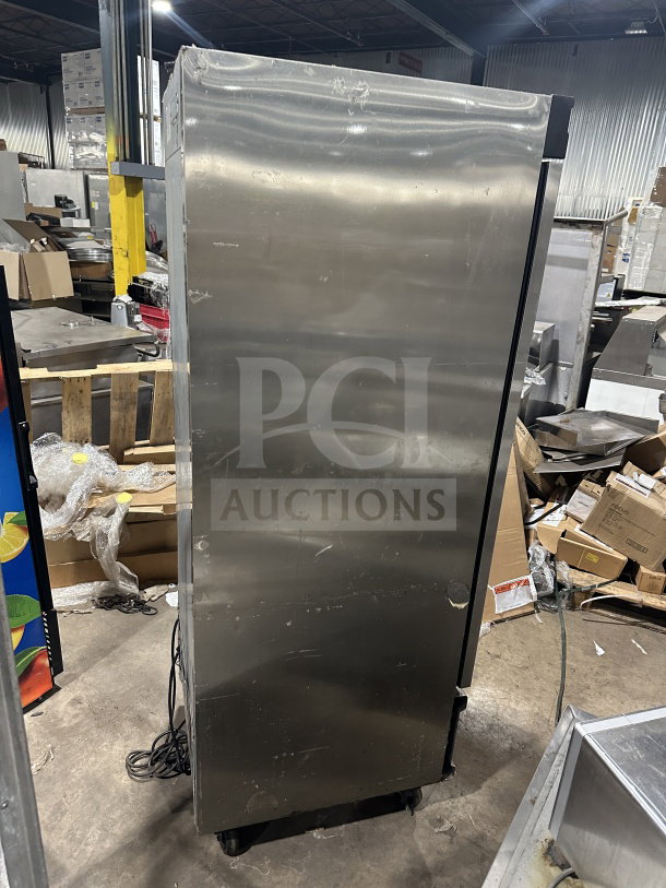 Everest EBF1 single door stainless steel reach-in freezer with poly coated wire rack, 115V, 1 phase, on casters.