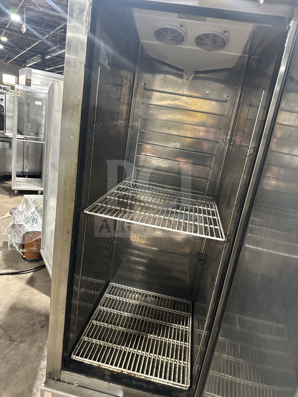 Everest EBF1 commercial stainless steel single door reach-in freezer with poly coated wire racks and casters. Model: EBF1 SN: 11500004.