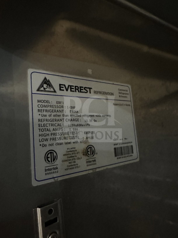Everest EBF1 commercial stainless steel reach-in freezer with poly coated wire rack, 115V, on casters. Serial: 11500004.
