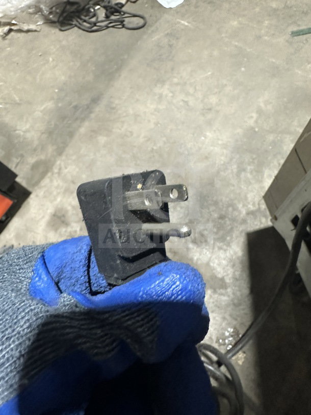 Alt text: Everest stainless steel single door reach-in freezer plug, model EBF1, showing a 115V connection, on casters.