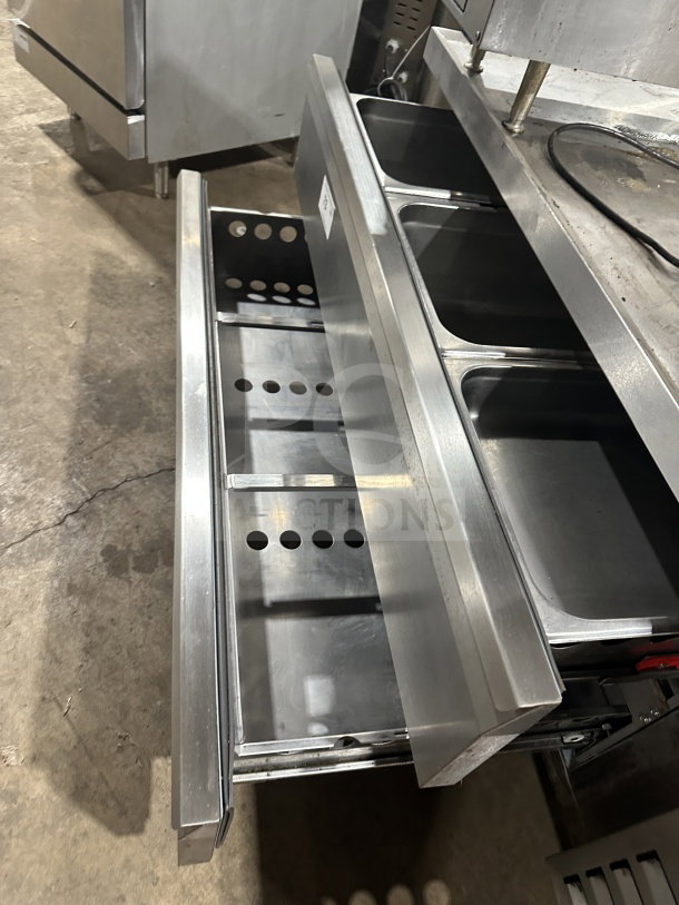 Arctic Air ARCB60CZ stainless steel 62" chef base with 2 drawers. Features refrigeration, on casters, S/N: H21271801.