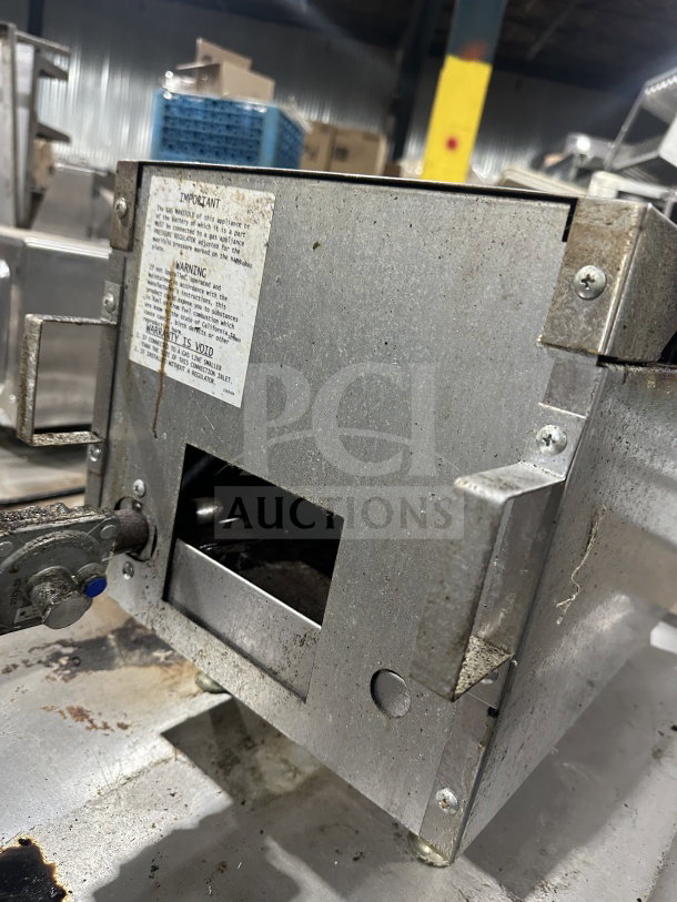 Southbend HDO-12 stainless steel natural gas 2-burner hotplate/range on legs, shown with label detailing usage and warnings.