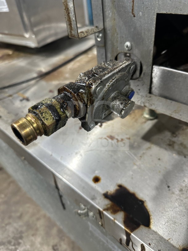 Southbend HDO-12 stainless steel countertop 2-burner hotplate, natural gas, on legs, visible wear and rust near connection.