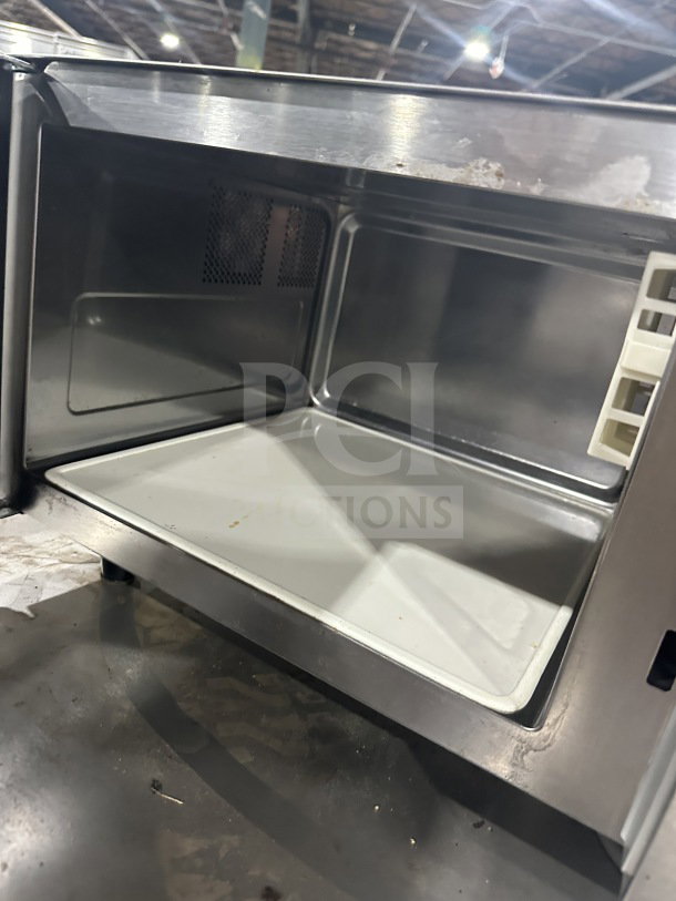 Solwave 180MW1000SS commercial stainless steel countertop microwave, 2023 model, digital controls, on legs, visible interior.